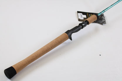 The St. Croix Avid Inshore ASIC76MLM 7'6" Medium Light Used Casting Rod, in mint condition, features a cork handle and black reel seat with a product tag—perfect for those interested in our rod and reel trade-in or used gear program.