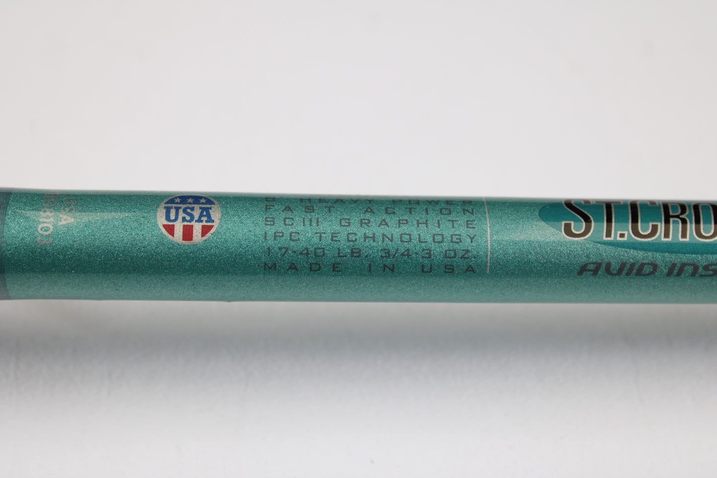 Close-up of a mint condition St. Croix Avid Inshore VIC80HF 8'0" Heavy used casting rod, labeled "USA" and "FAST ACTION." Ideal for upgrading through our rod and reel trade-in program for store credit.