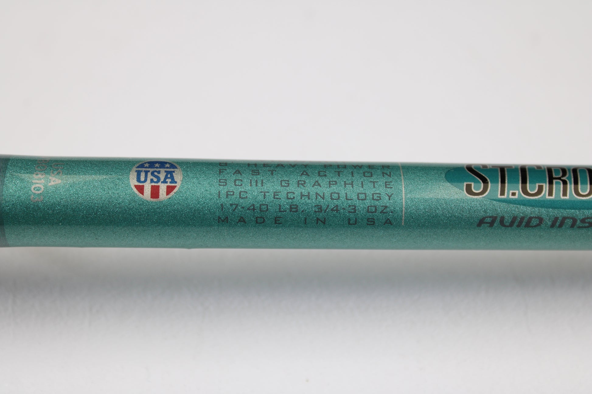 Close-up of a mint condition St. Croix Avid Inshore VIC80HF 8'0" Heavy used casting rod, labeled "USA" and "FAST ACTION." Ideal for upgrading through our rod and reel trade-in program for store credit.