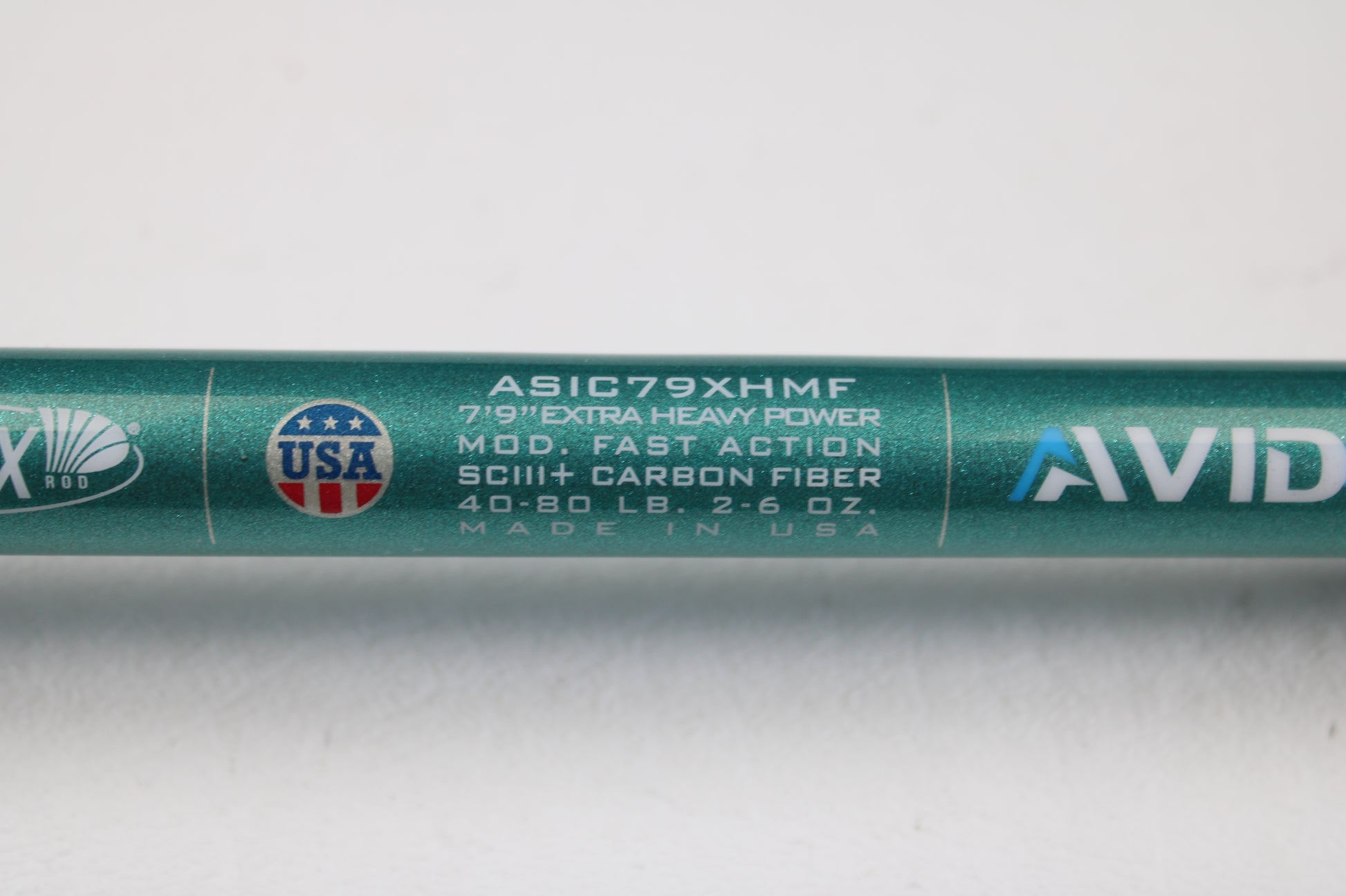 A close-up of a St. Croix Avid Inshore ASIC79XHMF 7'9" Extra Heavy Casting Rod (used, mint), showing specs and logos. Made in USA. Eligible for our rod and reel trade-in program for store credit on used gear.