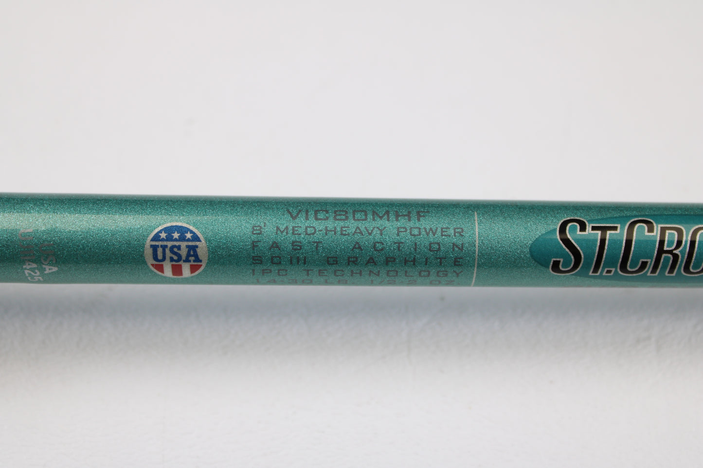 Close-up of a St. Croix Avid Inshore VIC80MHF 8'0" Medium Heavy Used Casting Rod in mint condition, featuring SCIII Graphite, IPC Technology, and made in the USA—perfect for our rod and reel trade-in program.