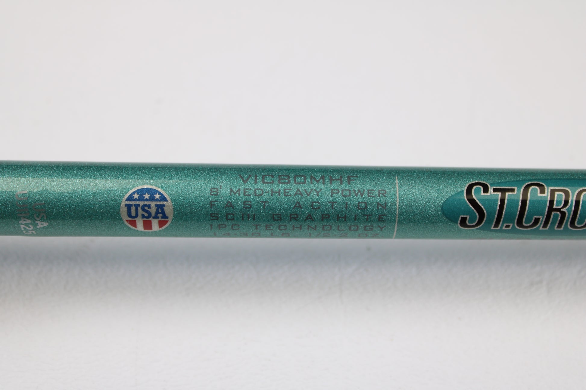 Close-up of a St. Croix Avid Inshore VIC80MHF 8'0" Medium Heavy Used Casting Rod in mint condition, featuring SCIII Graphite, IPC Technology, and made in the USA—perfect for our rod and reel trade-in program.