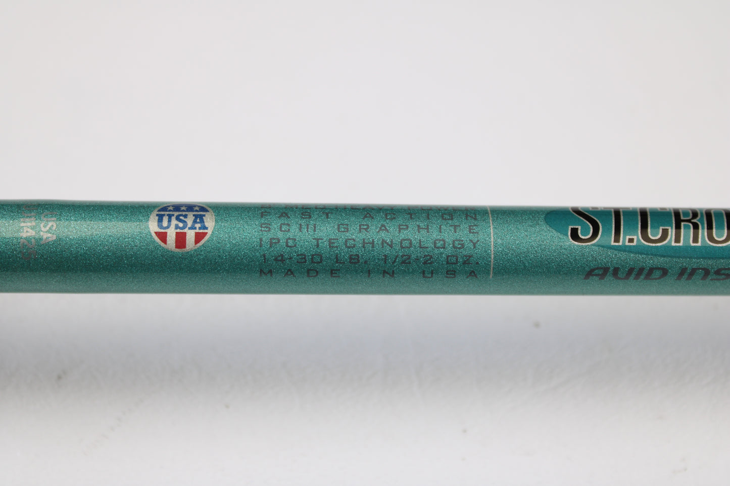 A close-up of a St. Croix Avid Inshore VIC80MHF 8'0" Medium Heavy Used Casting Rod in mint condition shows “Fast Action SCIII Graphite IPC Technology”—ideal for upgrading via our rod and reel trade-in program.