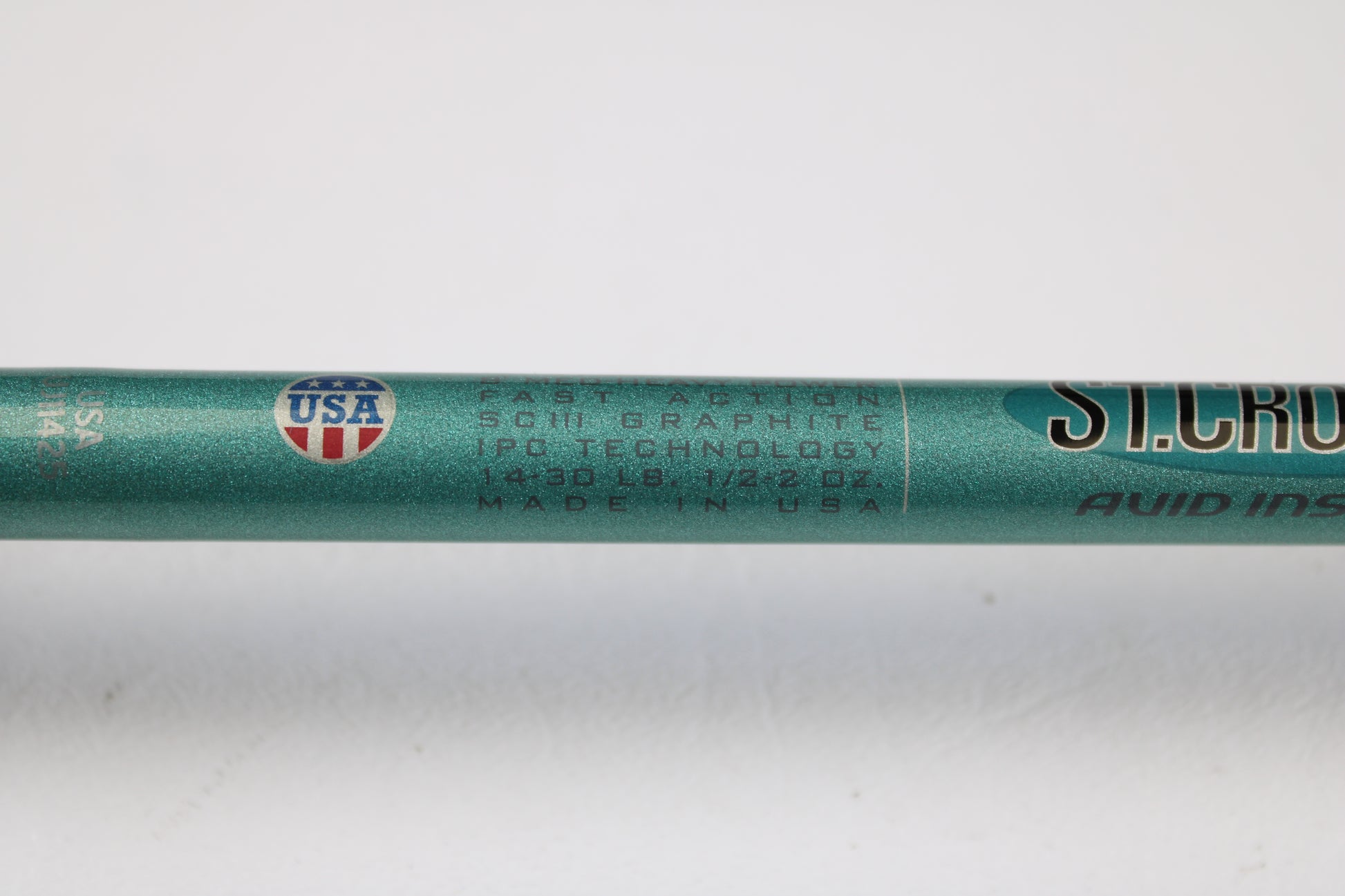 A close-up of a St. Croix Avid Inshore VIC80MHF 8'0" Medium Heavy Used Casting Rod in mint condition shows “Fast Action SCIII Graphite IPC Technology”—ideal for upgrading via our rod and reel trade-in program.