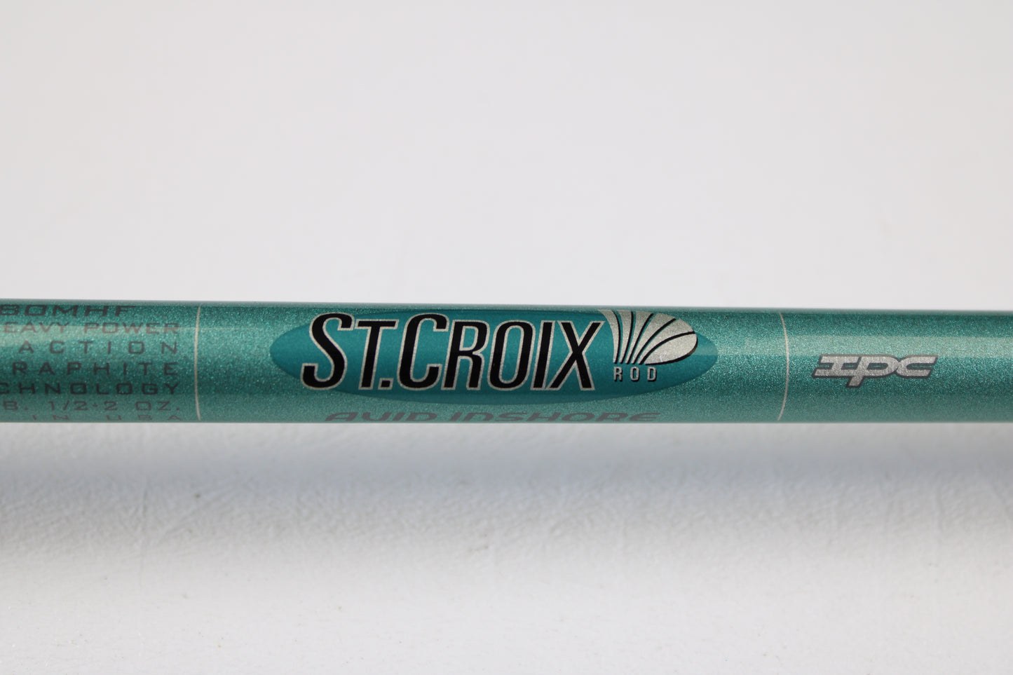 A close-up of the St. Croix Avid Inshore VIC80MHF 8'0" Medium Heavy casting rod in mint condition, showing "ST. CROIX ROD" and "IPC" logos—ideal for shoppers seeking quality used gear or exploring our trade-in program.