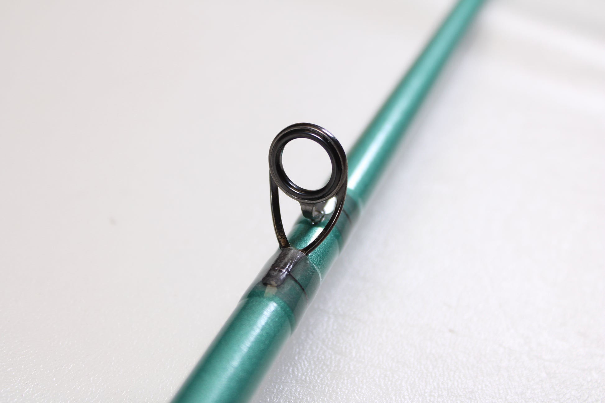 Close-up of the St. Croix Avid Inshore VIC80MHF 8'0" Medium Heavy Used Casting Rod in mint condition—ideal for anyone interested in our rod and reel trade-in program for store credit.