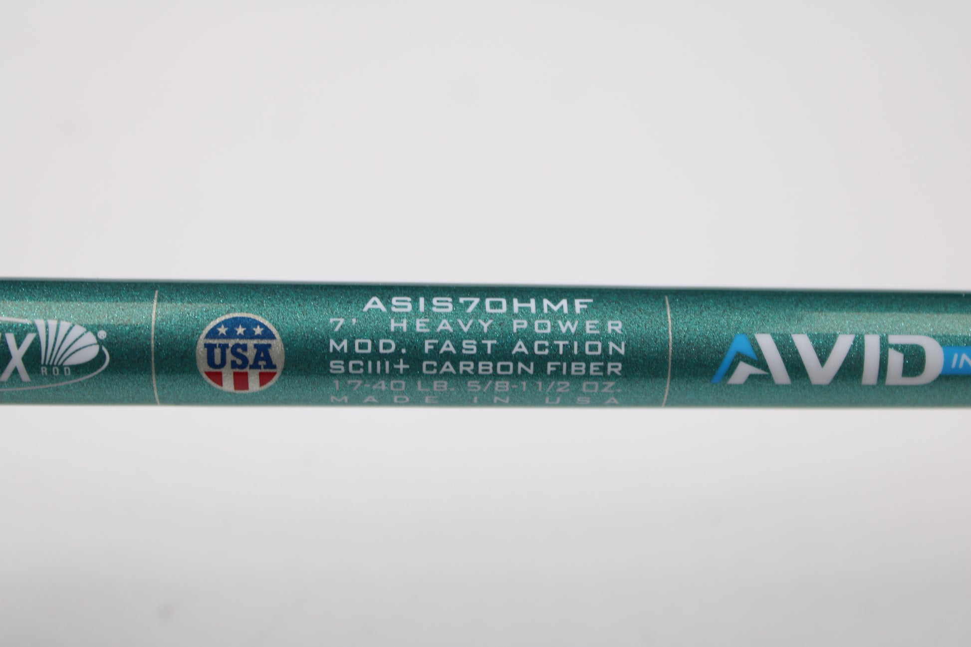 Close-up of a St. Croix Avid Inshore ASIS70HMF 7'0" heavy used spinning rod in mint condition; SCIII+ carbon fiber, fast action, 17-40lb, 5/8-1½ oz, Made in USA—eligible for rod/reel trade-in or store credit on used gear.