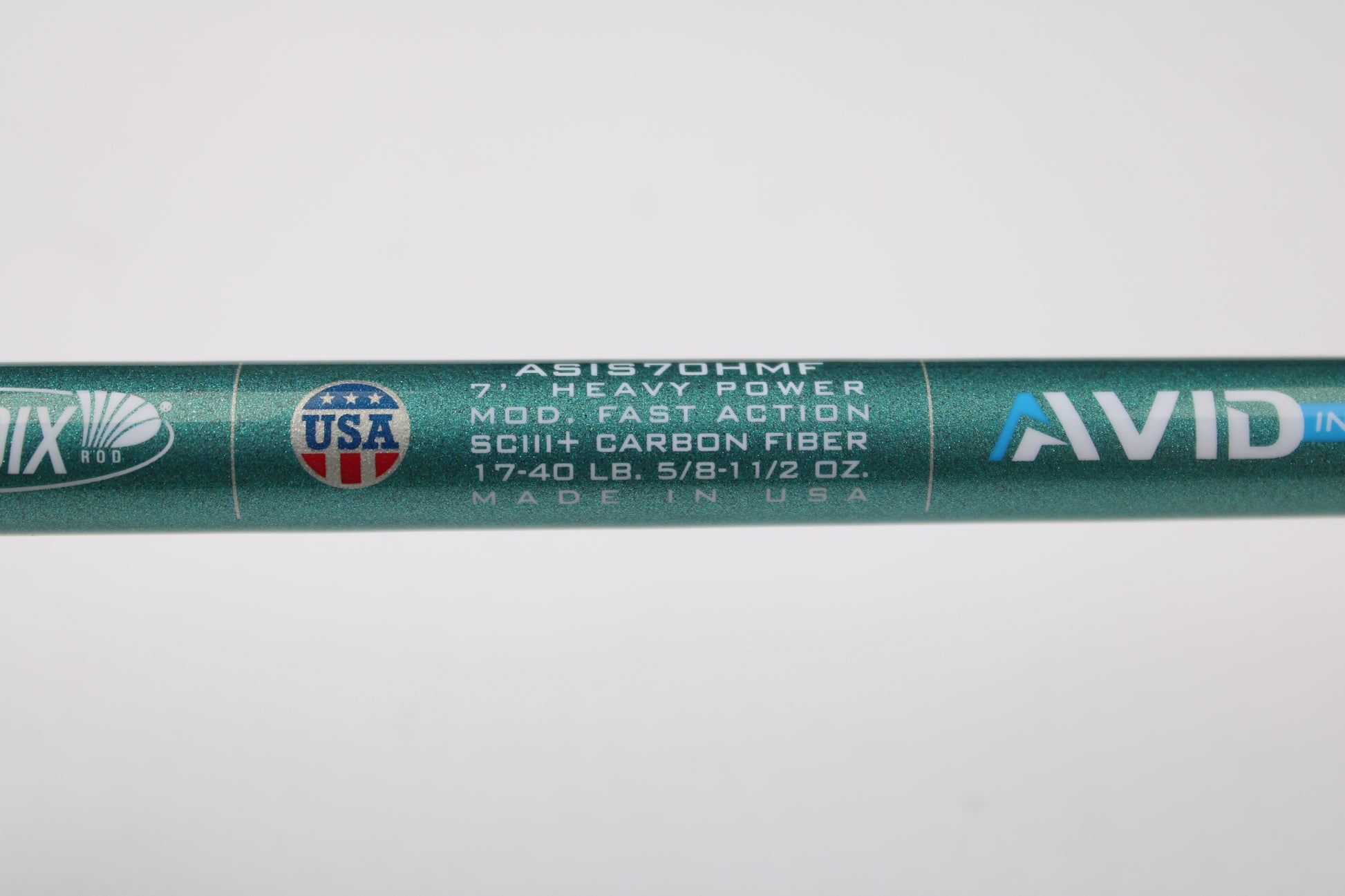 Close-up of a St. Croix Avid Inshore ASIS70HMF 7'0" heavy, moderate fast action SCIII carbon spinning rod—mint condition, made in USA. Trade in your used rods and reels for store credit with our trade-in program!.