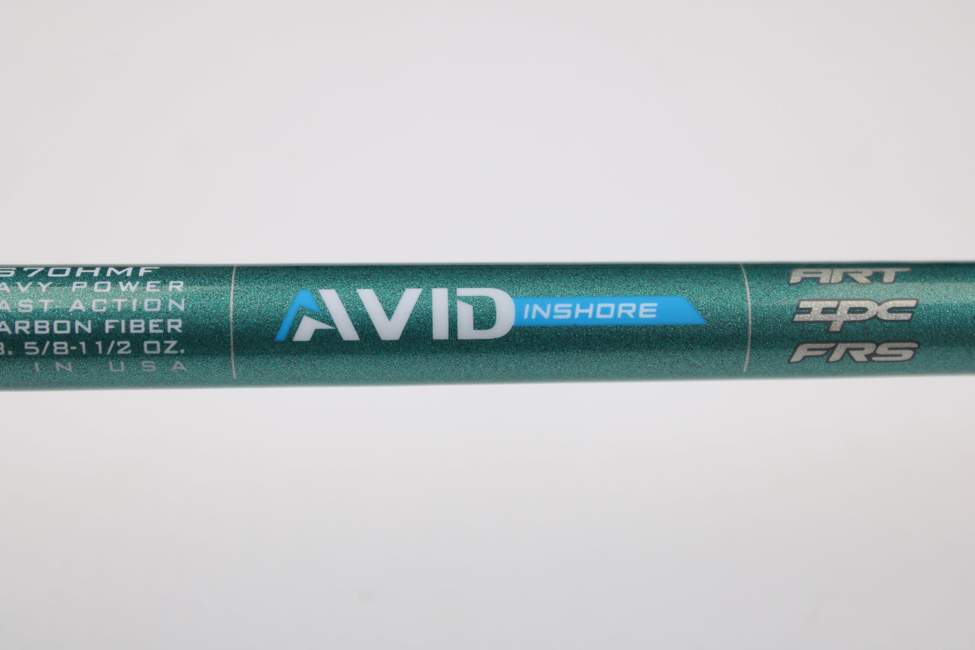 A close-up of the St. Croix Avid Inshore ASIS70HMF 7'0" Heavy Used Spinning Rod in mint condition highlights its features—perfect for our rod and reel trade-in program, where you get store credit for your used gear.