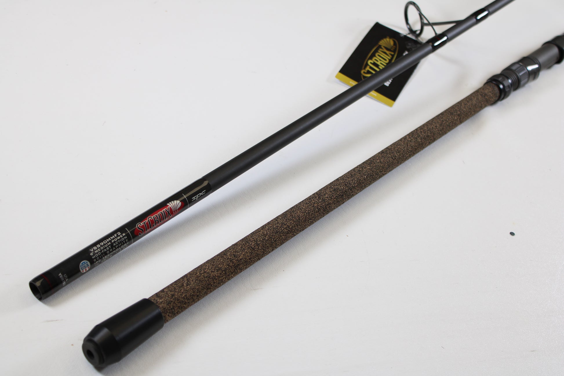 A St. Croix Avid Surf VSS90MMF2 9'0" used spinning rod in mint condition is displayed, ready for your next fishing adventure or as an ideal choice for our rod and reel trade-in program.