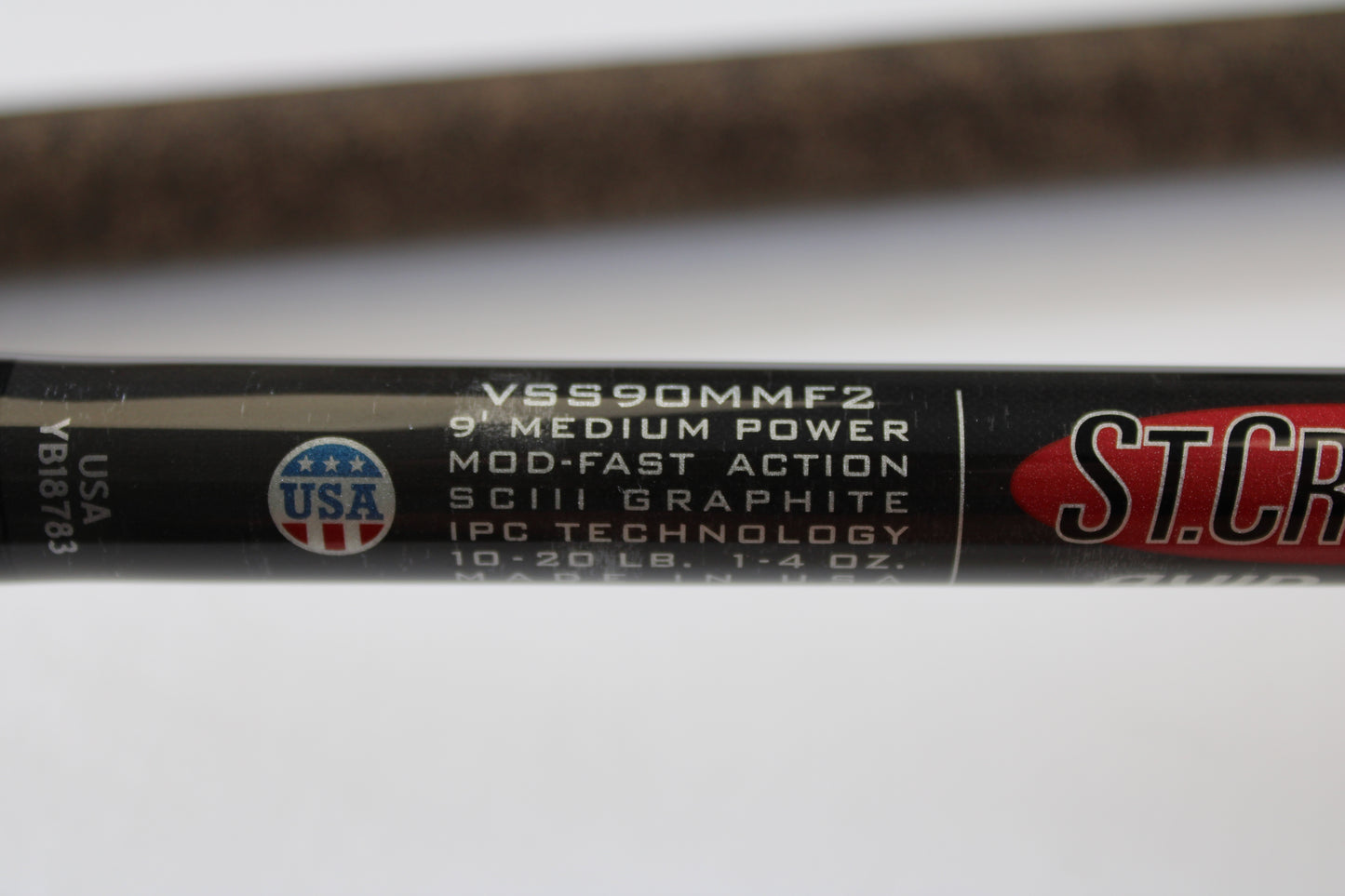 Close-up of the St. Croix Avid Surf VSS90MMF2 9'0" Medium Used Spinning Rod in mint condition, showing specs and a USA flag logo. Eligible for rod and reel trade-in toward store credit on used gear.