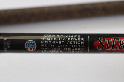 Close-up of the St. Croix Avid Surf VSS90MMF2 9'0" Medium Used Spinning Rod in mint condition, showing specs and a USA flag logo. Eligible for rod and reel trade-in toward store credit on used gear.