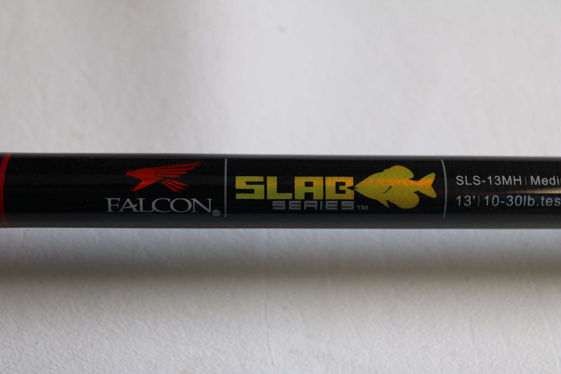 Close-up of a Falcon Slab Series SLS13MH 13'0" Medium Heavy 3pc used spinning rod in excellent condition—ideal for anglers seeking quality used gear or considering a rod and reel trade-in.