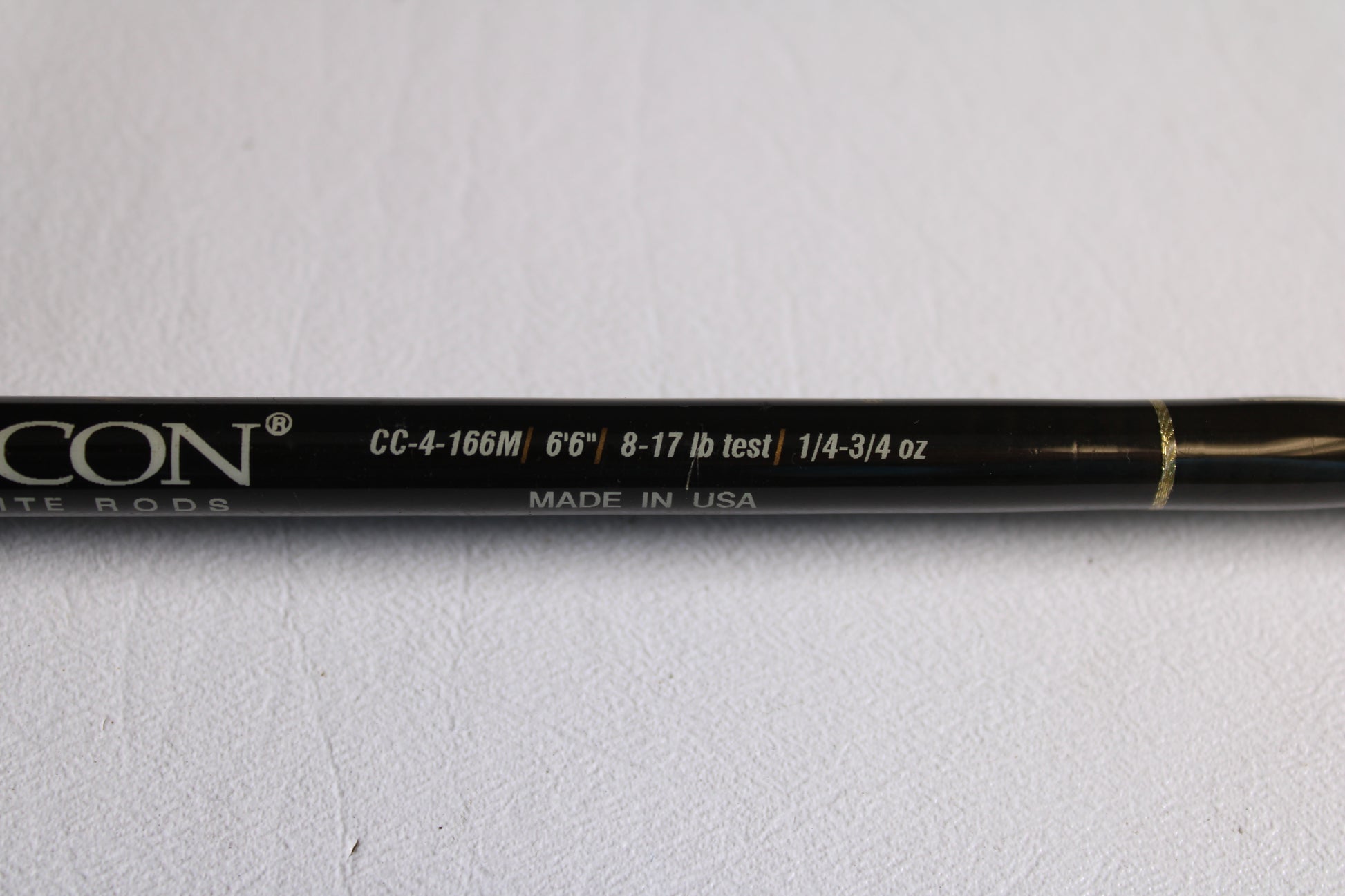 A close-up of the Falcon Cara T7 CC-4-166M 6'6" Medium Used Casting Rod (very good condition) showing specs: 8-17 lb line, 1/4-3/4 oz lure, Made in USA—ideal for used gear fans or rod and reel trade-in credit.