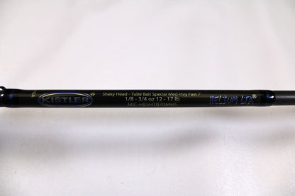 Close-up of a used Kistler Helium MIC-HESHTB70MHS 7'0" Medium Heavy spinning rod in excellent condition on a white background—eligible for our Rod and Reel Trade-In Program for store credit.