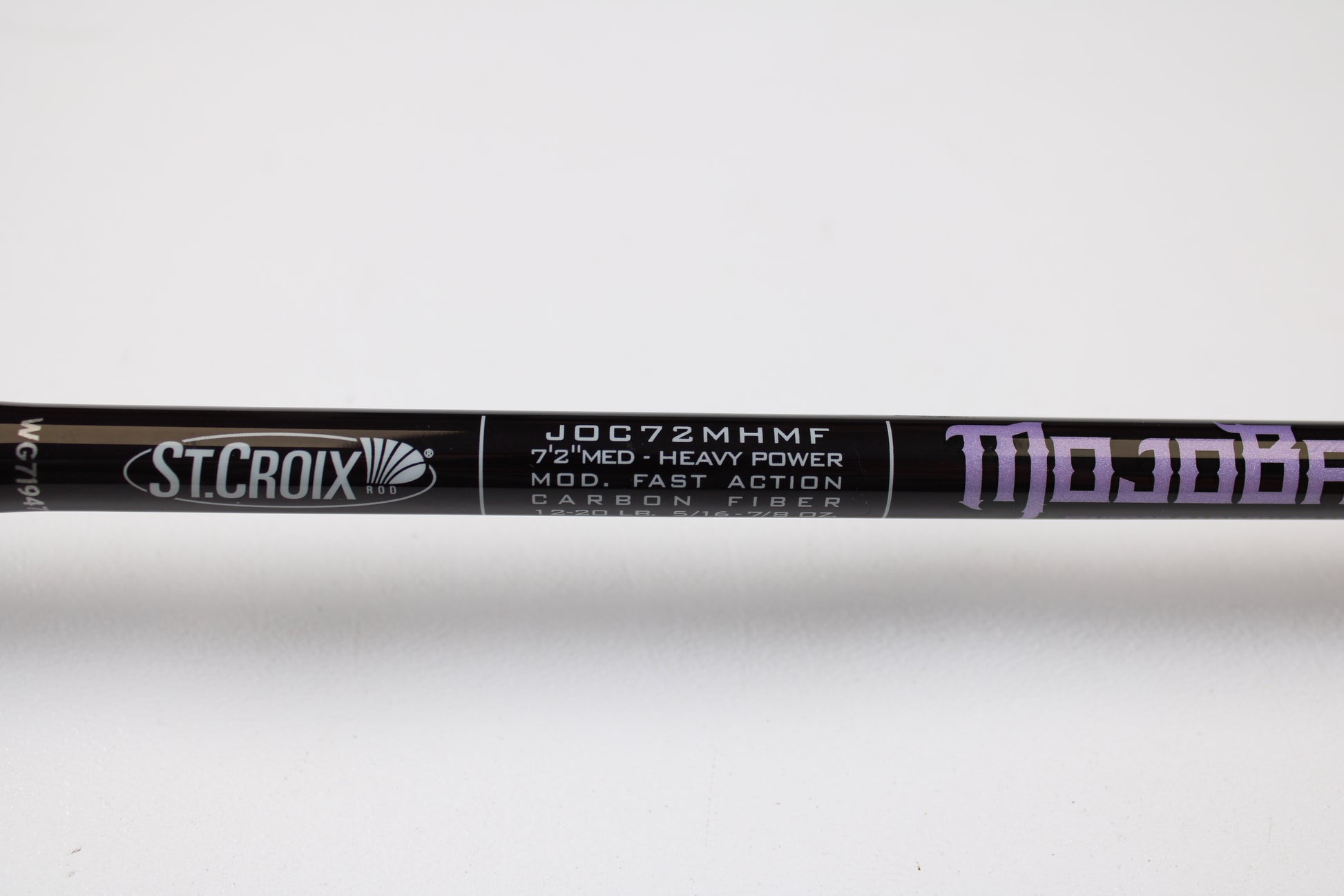 Close-up of a used St. Croix Mojo Bass JOC72MHMF Finesse Carbon Cranker 7'2" Medium Heavy casting rod in excellent condition—ideal for the Rod and Reel Trade-In Program. "ST. CROIX" and "MOJO" logos visible on carbon fiber finish.