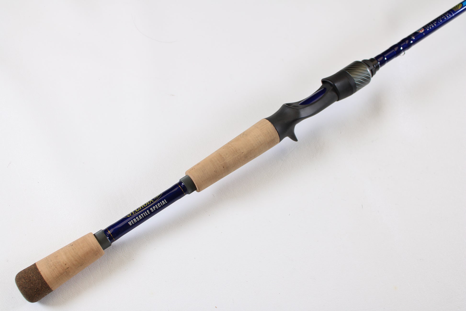 The St. Croix Legend Tournament Pike Versatile Special LTPC216MHF 7'1" Medium Heavy Used Casting Rod features light wood and cork grips, a black reel seat, and a dark blue shaft—ideal for upgrades via our trade-in program. Shown on a plain white background.