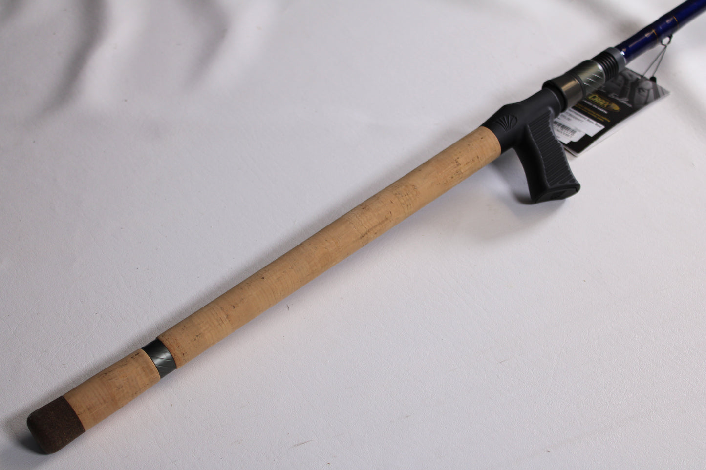 The St. Croix Legend Tournament Bass LBTC86XXHFT Magnum Swimbait 8'6" XXH Casting Rod—used and in mint condition—is shown with its cork handle, black reel seat, and product tag, ideal for our Rod and Reel Trade-In Program.