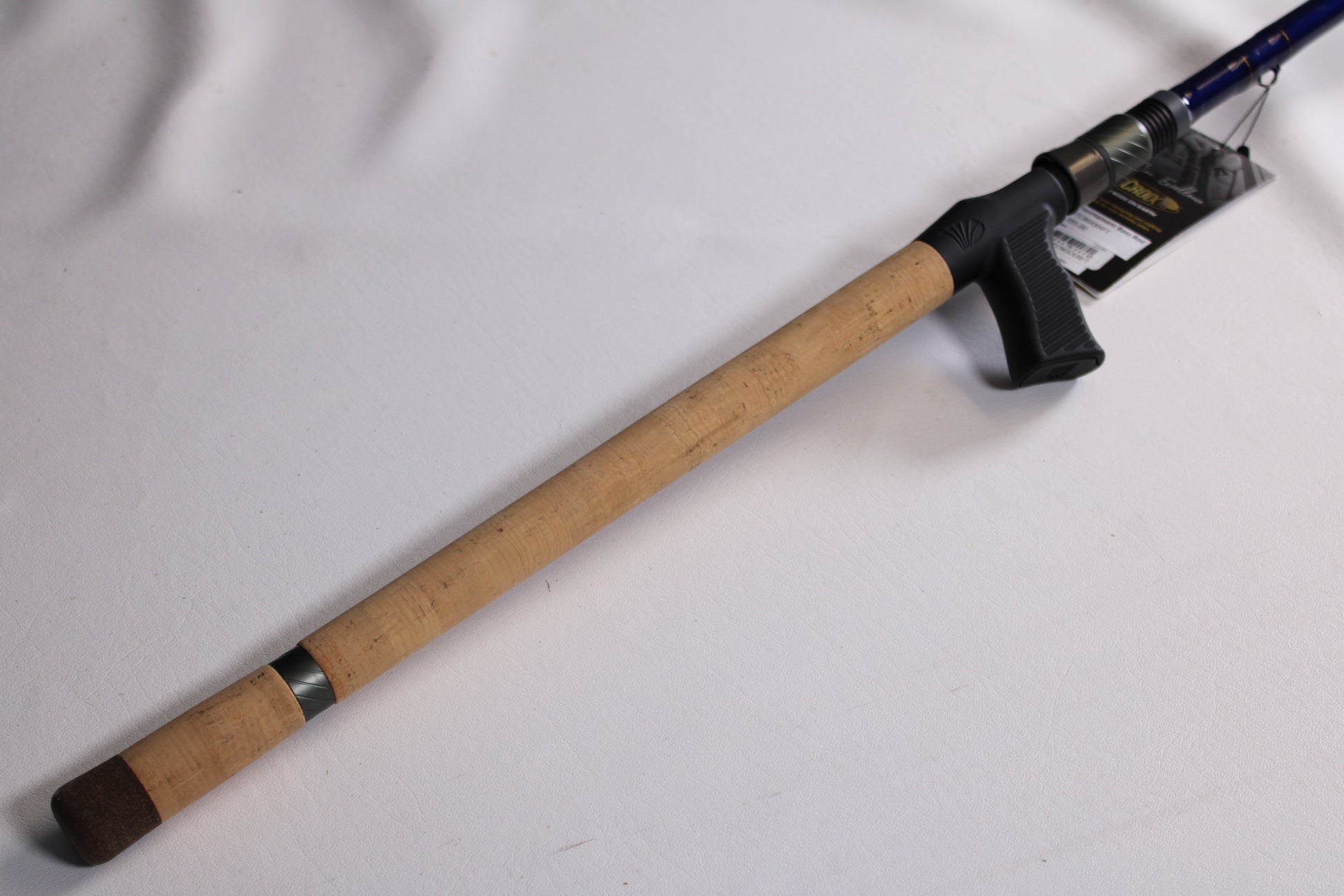 The St. Croix Legend Tournament Bass LBTC86XXHFT Magnum Swimbait 8'6" XXH Casting Rod—used and in mint condition—is shown with its cork handle, black reel seat, and product tag, ideal for our Rod and Reel Trade-In Program.