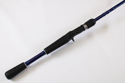 A close-up of the Douglas LRS C704M 7'0" Medium used casting rod in very good condition, with a black handle and blue shaft, shown on a white background. Eligible for our Rod and Reel Trade-In Program for store credit.
