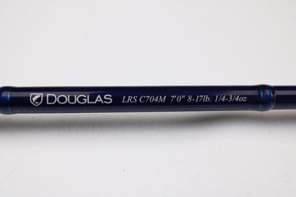 A close-up of the Douglas LRS C704M 7'0" Medium Used Casting Rod in very good condition, featuring white text on a blue rod—trade in your old gear for store credit with our Rod and Reel Trade-In Program.