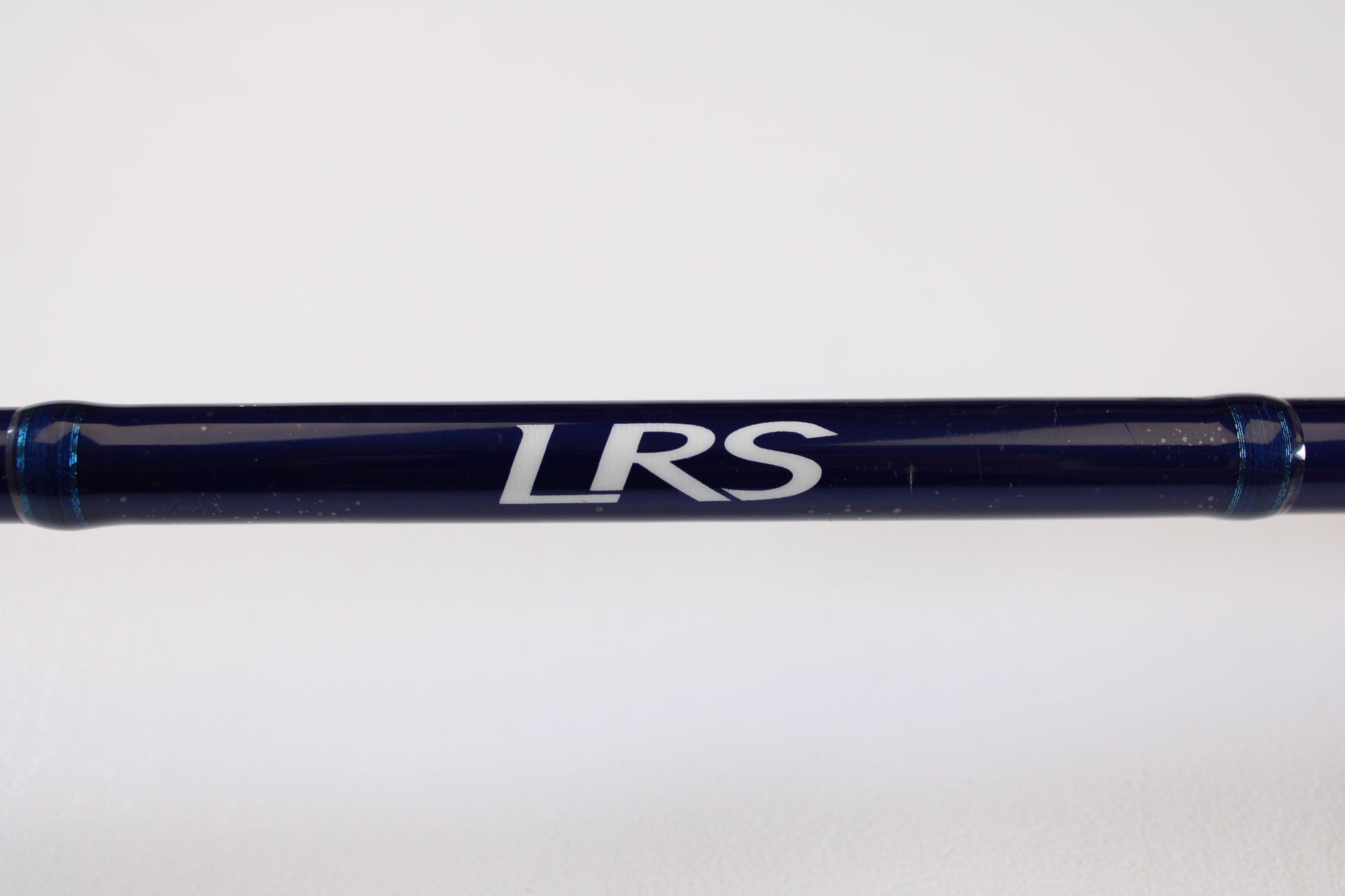 A Douglas LRS C704M 7'0" Medium, used casting rod in very good condition, featuring dark blue color with "LRS" in white—ideal for anglers upgrading via our Rod and Reel Trade-In Program or earning store credit with used gear.