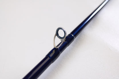 A close-up of the Douglas LRS C704M 7'0" Medium Used Casting Rod in very good condition highlights a metal line guide—ideal for featuring your used Douglas gear in our Rod and Reel Trade-In Program to earn store credit.