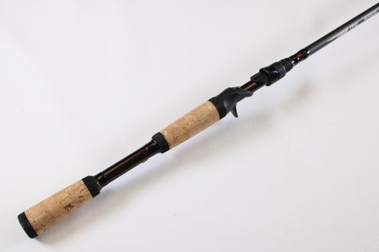 The Temple Fork Tactical Bass TAC SB 726-1 7'2" Heavy Used Casting Rod—excellent condition—shown on a white background, is ideal for upgrading through our Rod and Reel Trade-In Program or earning store credit with used gear.