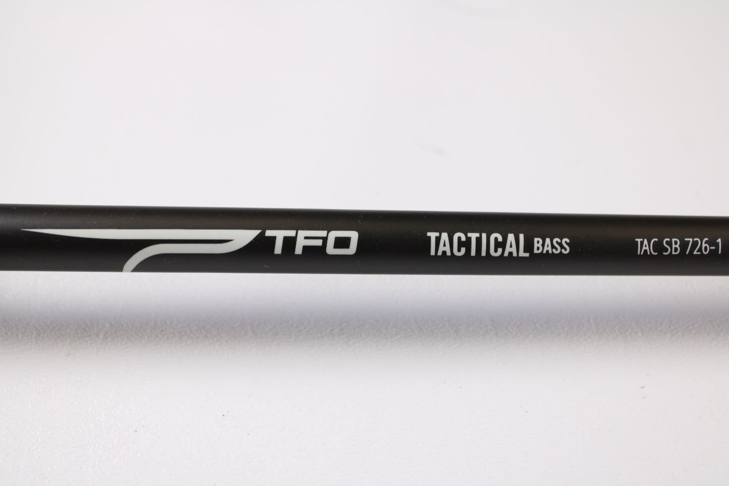 A close-up of a Temple Fork Tactical Bass TAC SB 726-1 7'2" Heavy Used Casting Rod in excellent condition on a white background—ideal for those exploring our Rod and Reel Trade-In Program or shopping quality used gear.