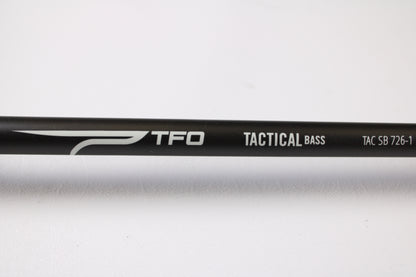 A close-up of a Temple Fork Tactical Bass TAC SB 726-1 7'2" Heavy Used Casting Rod in excellent condition on a white background—ideal for those exploring our Rod and Reel Trade-In Program or shopping quality used gear.