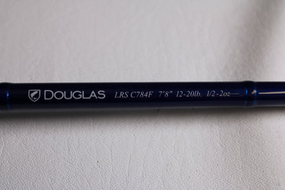 Close-up of a blue Douglas LRS LRSC784F 7'8" Medium Used Casting Rod in excellent condition—ideal for our rod and reel trade-in program or for earning store credit on used gear.