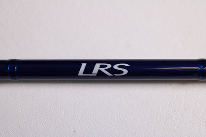 A Douglas LRS LRSC784F 7'8" Medium Used Casting Rod in excellent condition, dark blue with "LRS" lettering, shown on a white surface—may be eligible for store credit through our rod and reel trade-in program.