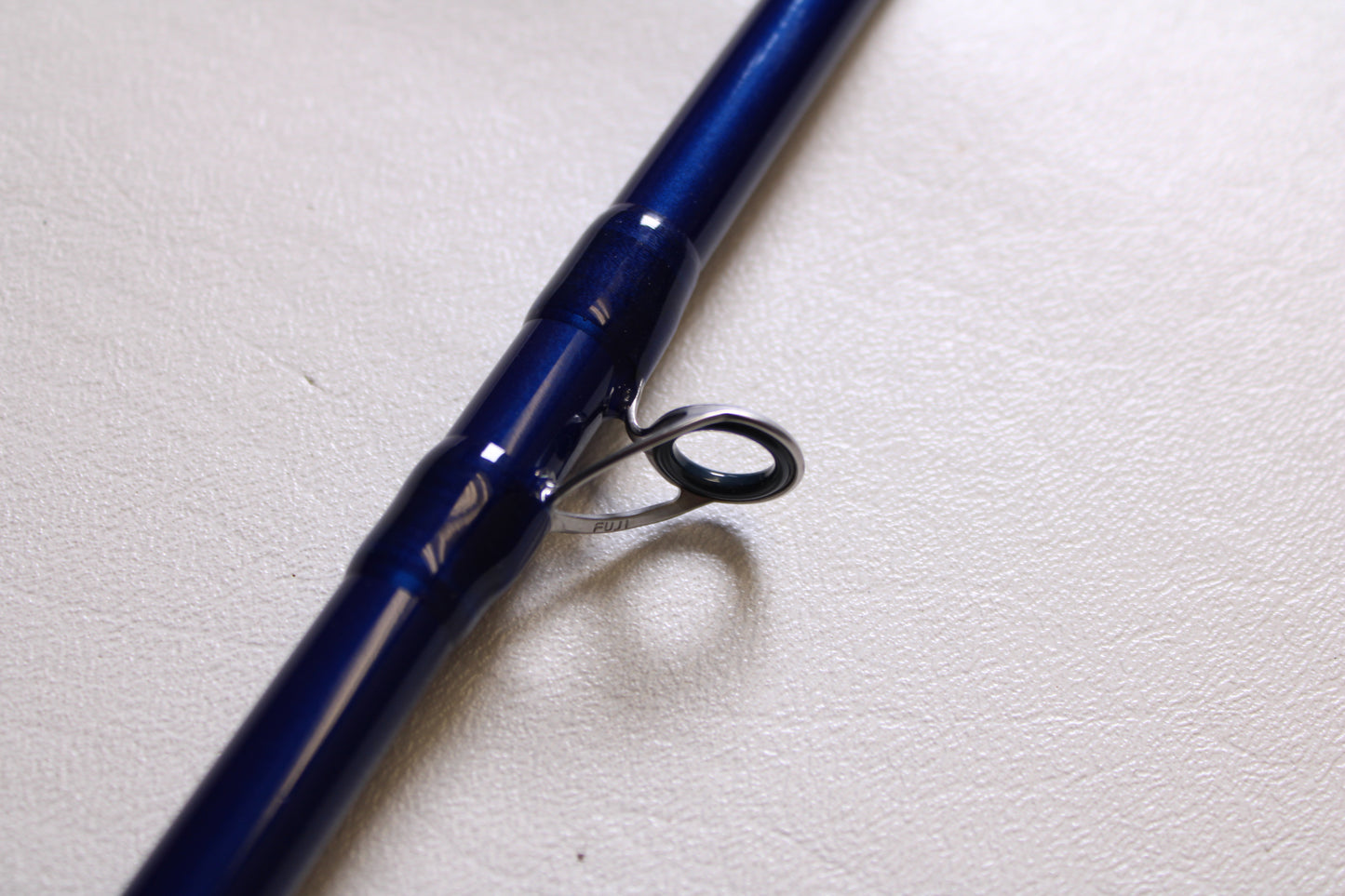 A close-up of the Douglas LRS LRSC784F 7'8" Medium used casting rod in excellent condition, highlighting a metal line guide—ideal for listing your pre-owned gear in our rod and reel trade-in program for store credit.