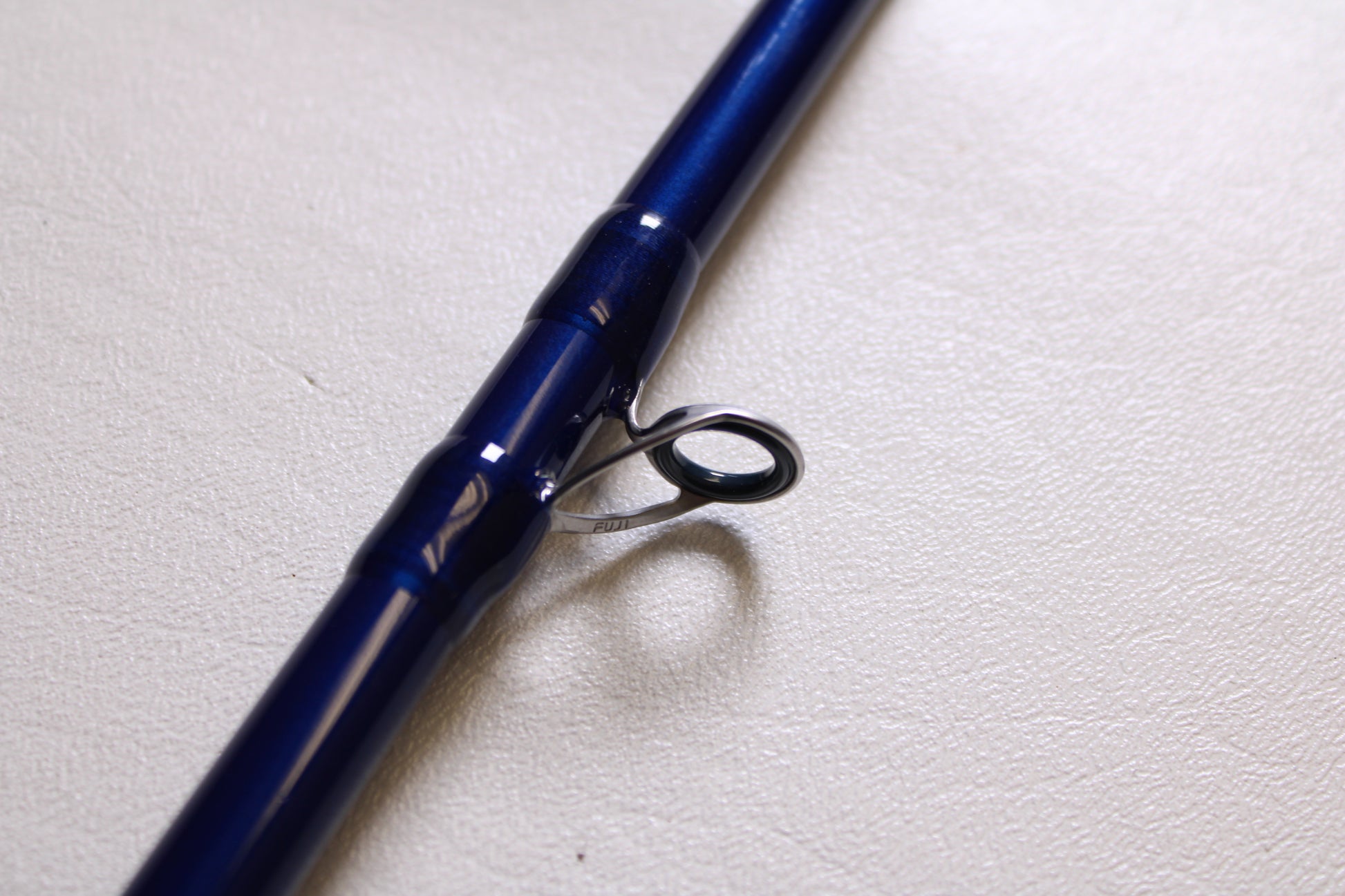 A close-up of the Douglas LRS LRSC784F 7'8" Medium used casting rod in excellent condition, highlighting a metal line guide—ideal for listing your pre-owned gear in our rod and reel trade-in program for store credit.