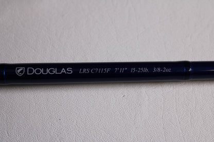 A close-up of a Douglas LRS LRSC7115F 7'11" Heavy Used Casting Rod in excellent condition, showing details on its shaft—ideal for those interested in our Rod and Reel Trade-In Program for store credit.