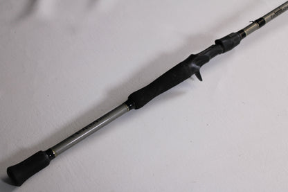 A close-up of the Fitzgerald Vursa VS76H Pitchin' & Flippin' 7'6" Medium Used Casting Rod—Good Condition, with a black handle and trigger grip, ideal for those seeking quality pre-owned gear or our Rod and Reel Trade-In Program.