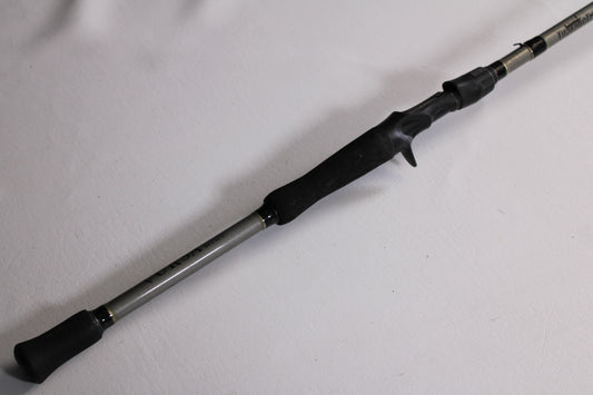 A close-up of the Fitzgerald Vursa VS76H Pitchin' & Flippin' 7'6" Medium Used Casting Rod—Good Condition, with a black handle and trigger grip, ideal for those seeking quality pre-owned gear or our Rod and Reel Trade-In Program.