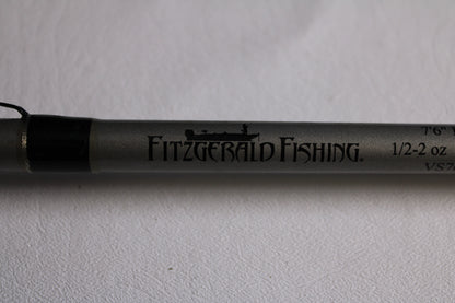 A close-up of the Fitzgerald Vursa VS76H Pitchin' & Flippin' 7'6" Medium used casting rod in good condition, with the Fitzgerald logo and specs—ideal for trading in through our Rod and Reel Trade-In Program.