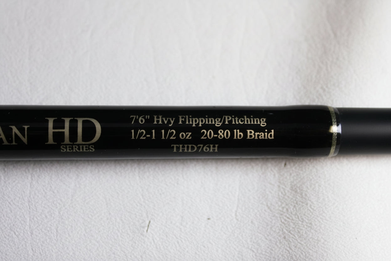 Close-up of Fitzgerald Titan HD THD76H 7'6" Heavy Used Casting Rod in very good condition—features 1/2-1 1/2 oz, 20-80 lb braid. Eligible for our Rod and Reel Trade-In Program—trade your used gear for store credit today!.