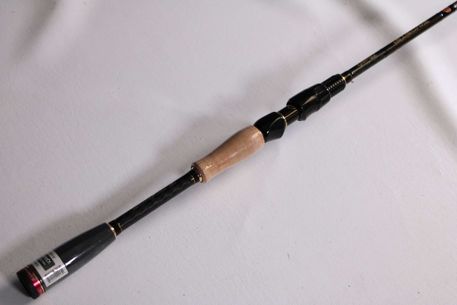 A close-up of the Evergreen Favorite Fishing Rush RUH-661MH 6'6" Medium Heavy Used Spinning Rod in excellent condition—ideal for highlighting quality gear from our Rod and Reel Trade-In Program.