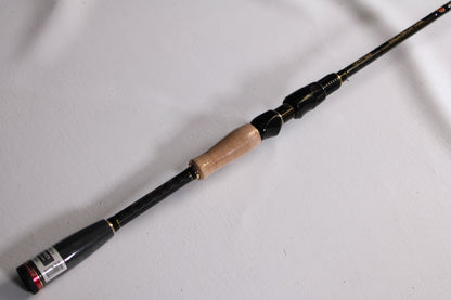 A close-up of the Evergreen Favorite Fishing Rush RUH-661MH 6'6" Medium Heavy Used Spinning Rod in excellent condition—ideal for highlighting quality gear from our Rod and Reel Trade-In Program.