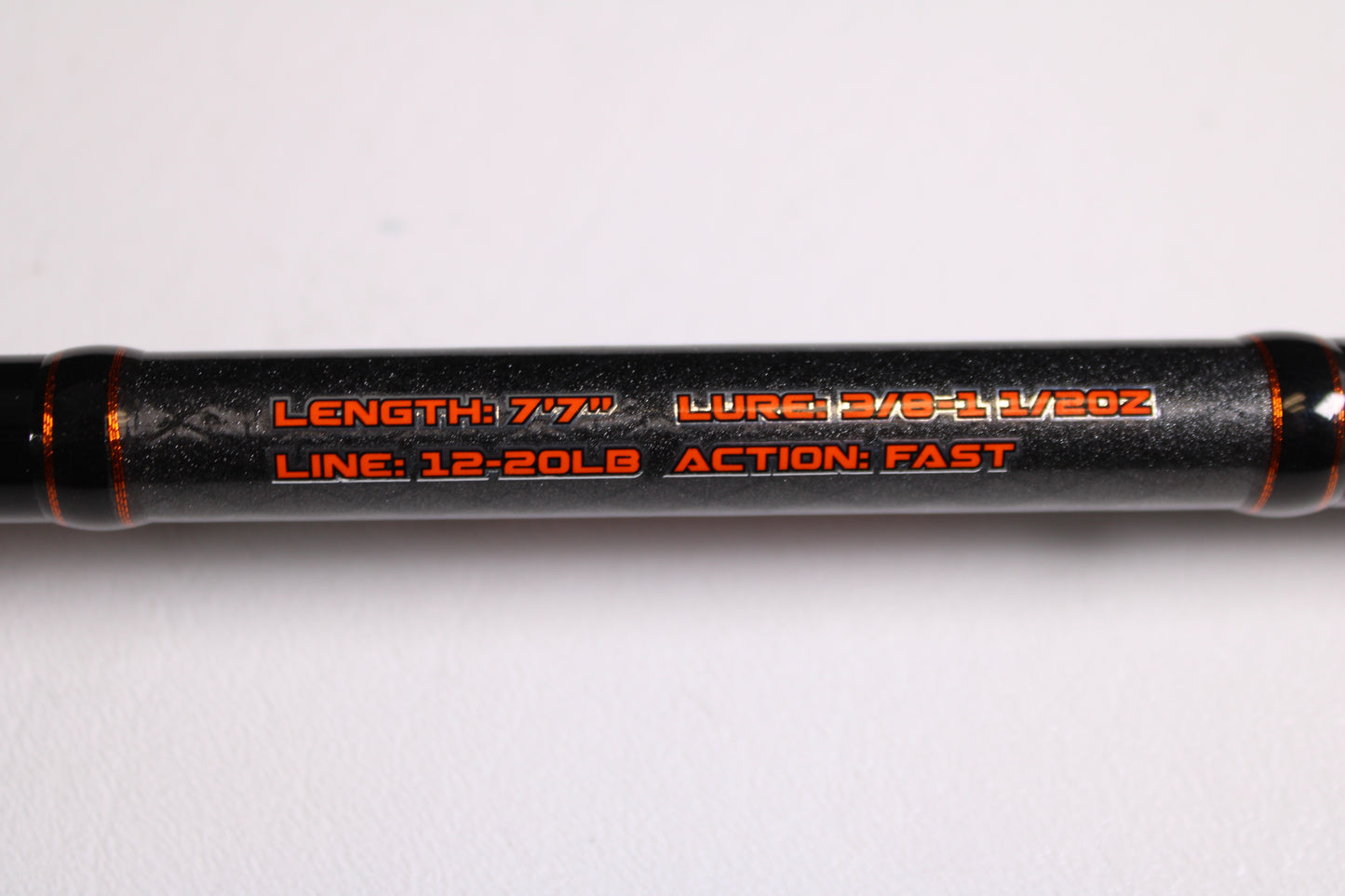 Close-up of Favorite Fishing Rush Zach Birge RUHC-ZB-771H 7'7" Heavy used casting rod in excellent condition, showing specs—3/8–1 1/2 oz lure, 12–20 lb line, fast action—ideal for our Rod and Reel Trade-In Program for store credit.