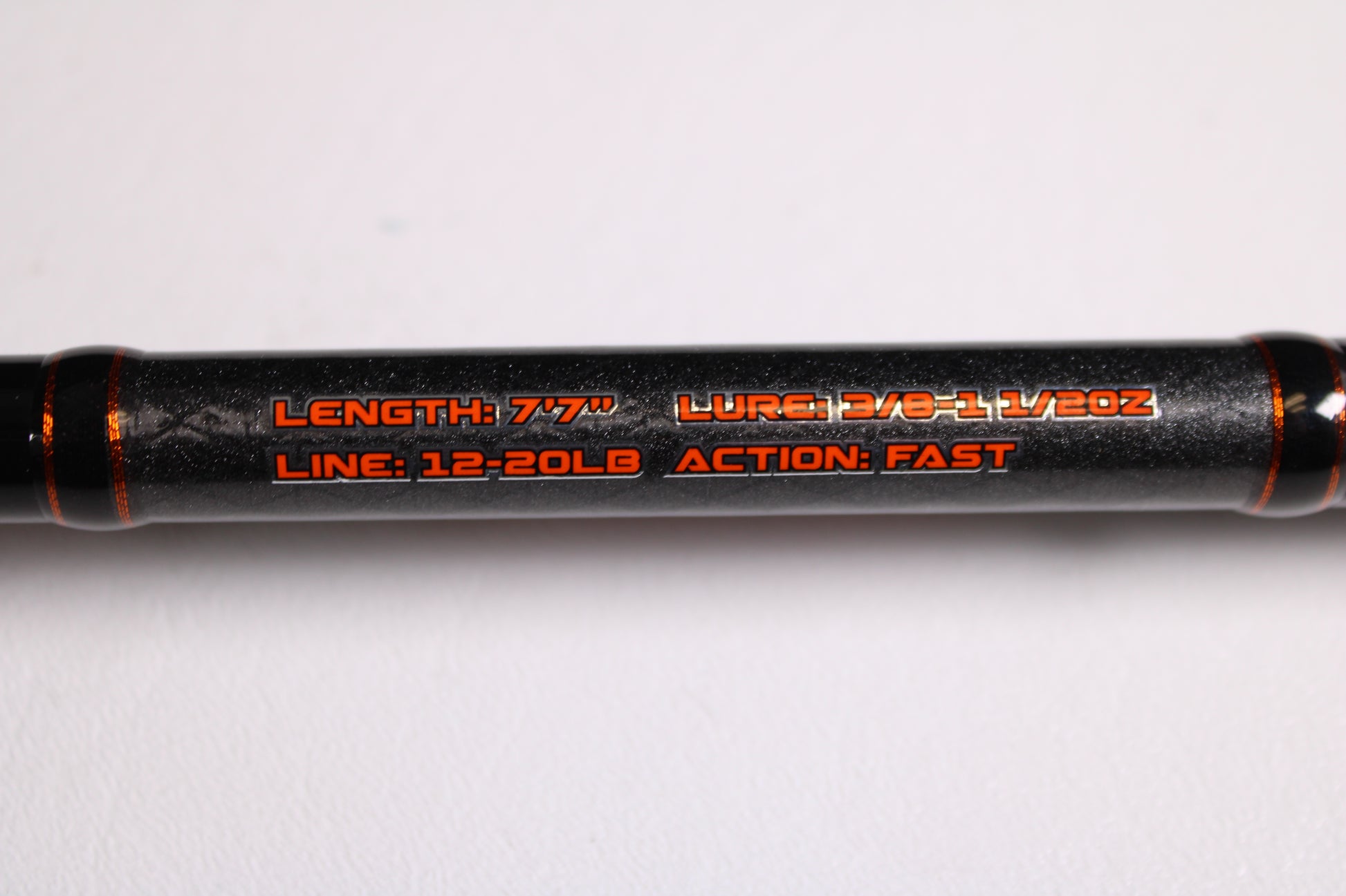 Close-up of Favorite Fishing Rush Zach Birge RUHC-ZB-771H 7'7" Heavy used casting rod in excellent condition, showing specs—3/8–1 1/2 oz lure, 12–20 lb line, fast action—ideal for our Rod and Reel Trade-In Program for store credit.