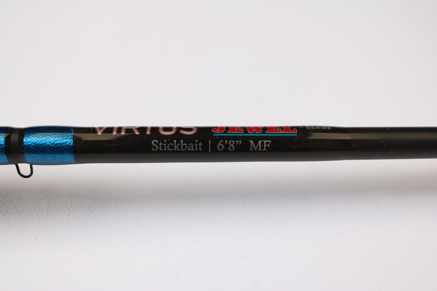 Close-up of a Jewel Virtus Stickbait 6'8" Medium Used Casting Rod in excellent condition, black and blue shaft, shown on white—ideal for anglers upgrading with our Rod and Reel Trade-In Program for store credit.