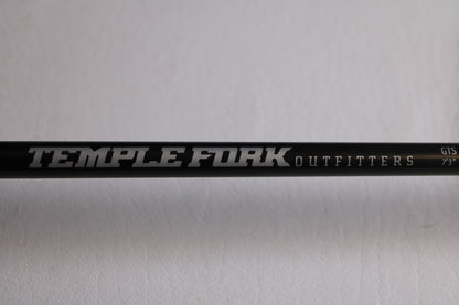 A close-up of the Temple Fork GTS Bass S735-1 7'3" Medium Heavy Used Spinning Rod in excellent condition, shown with white and silver branding—ideal for upgrading through our rod and reel trade-in program for store credit.