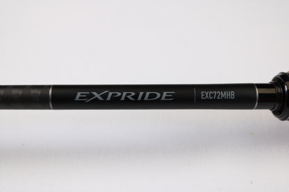 A close-up of a Shimano Expride B EXC72MHB 7'2" Medium Heavy Used Casting Rod in excellent condition, set against a white background—great for those interested in used gear or store credit through our Rod and Reel Trade-In Program.