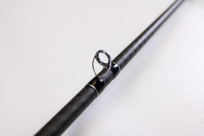 Close-up of a Shimano Expride B EXC72MHB 7'2" Medium Heavy Used Casting Rod in excellent condition, highlighting a metallic line guide—ideal for those trading in gear or upgrading with our Rod and Reel Trade-In Program.
