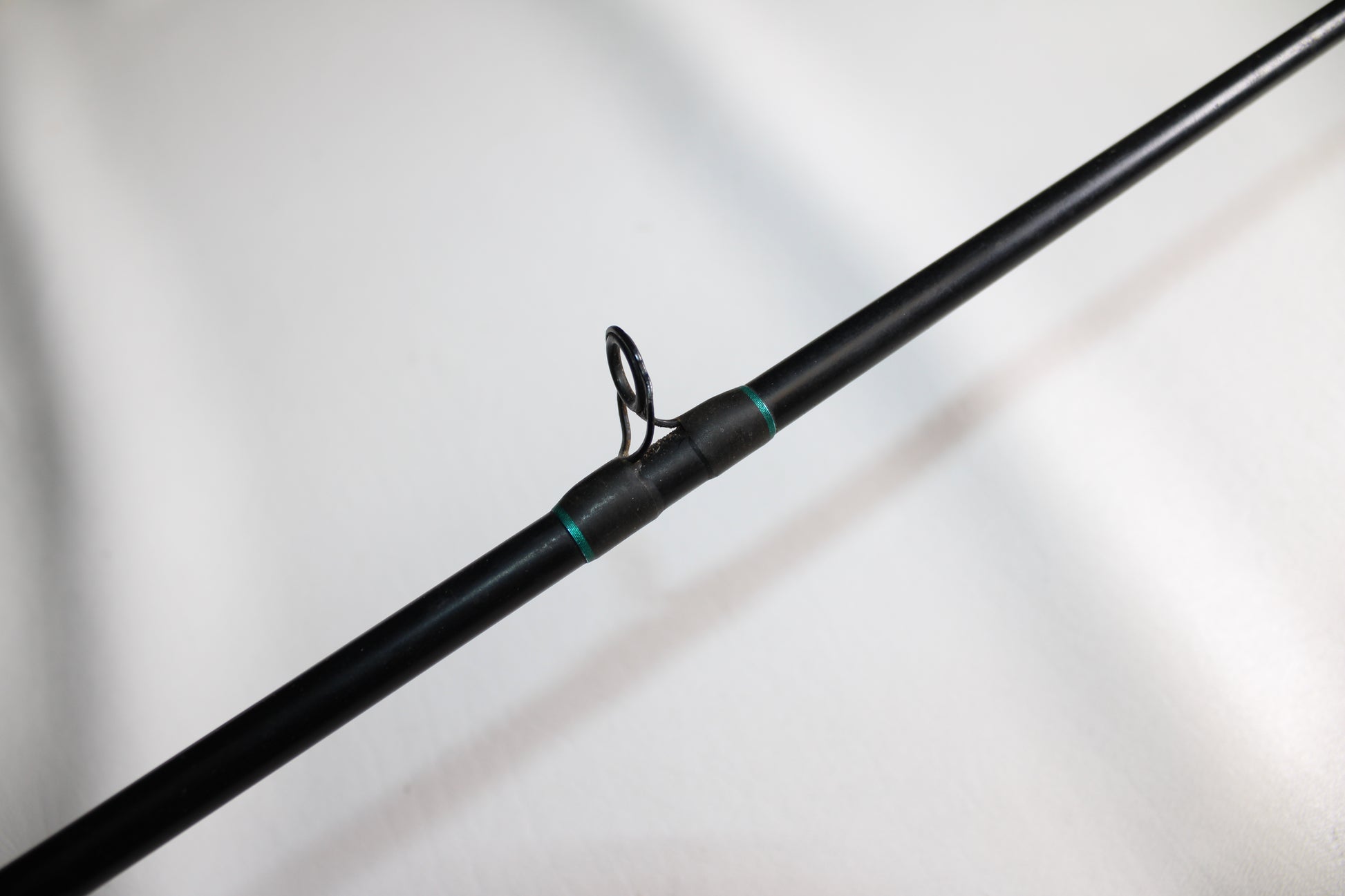 Close-up of a St. Croix Premier PC66MF Used Casting Rod in good condition, featuring a single metal line guide against a plain white background.