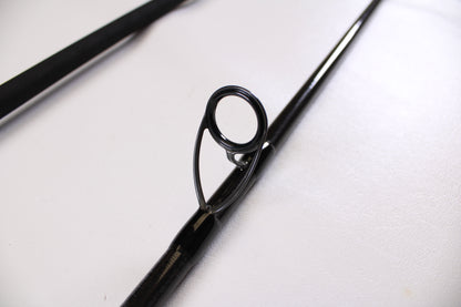 Close-up of a black guide on the ODM Rods Genesis Surf NGX-114 11'0" 2 Piece Used Spinning Rod in excellent condition—ideal for anglers seeking quality pre-owned gear from ODM Rods.