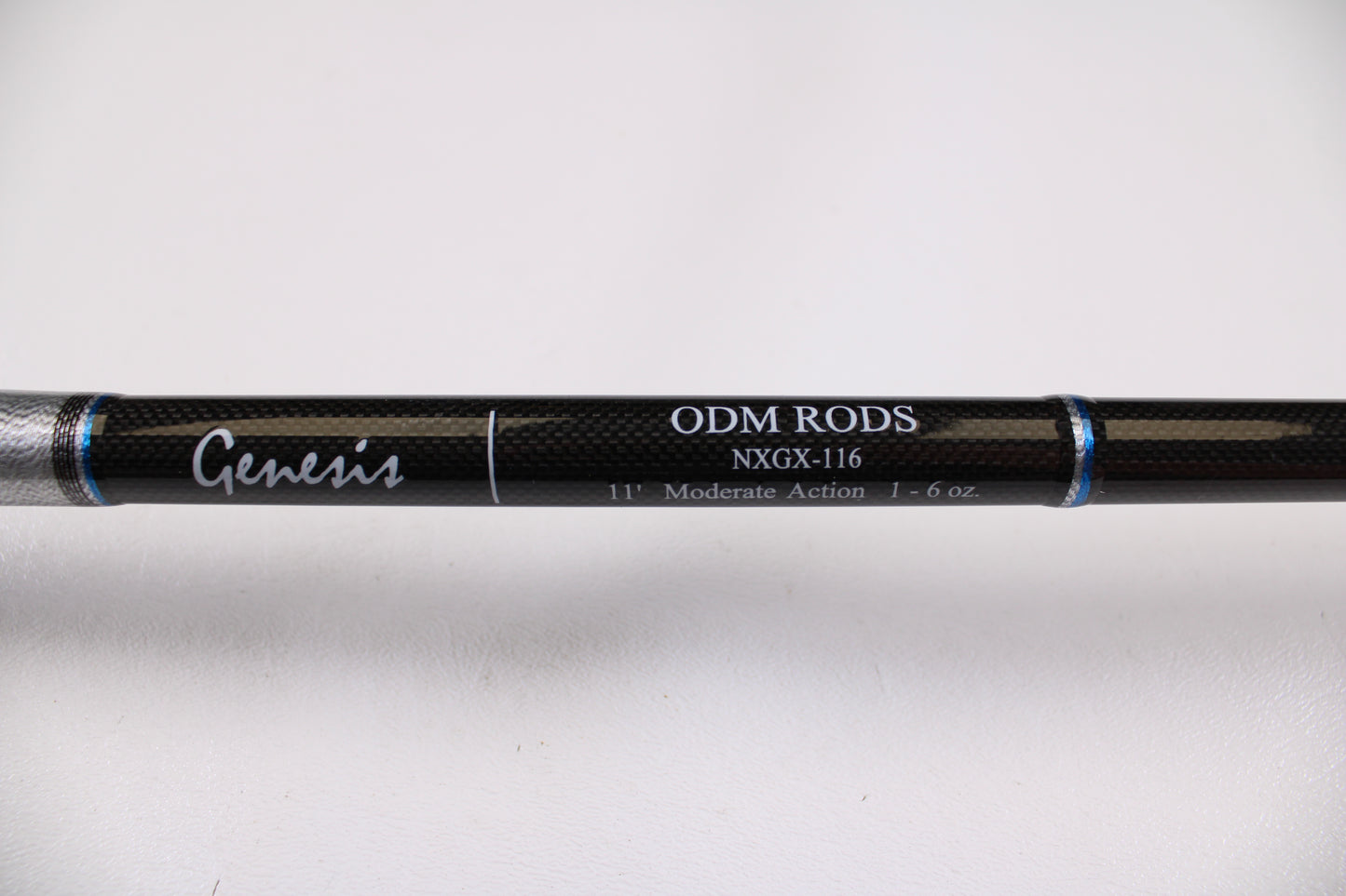 Close-up of the ODM Rods Genesis Surf NGX-116 11'0" 2 Piece used spinning rod in excellent condition. Black shaft shows "11', Moderate Action, 1-6 oz." Ideal for upgrading through our rod and reel trade-in program. Plain white background.